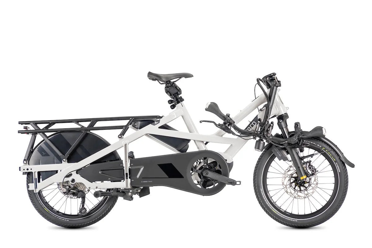 Semi-folded white Tern cargo bike with black rack on a white background