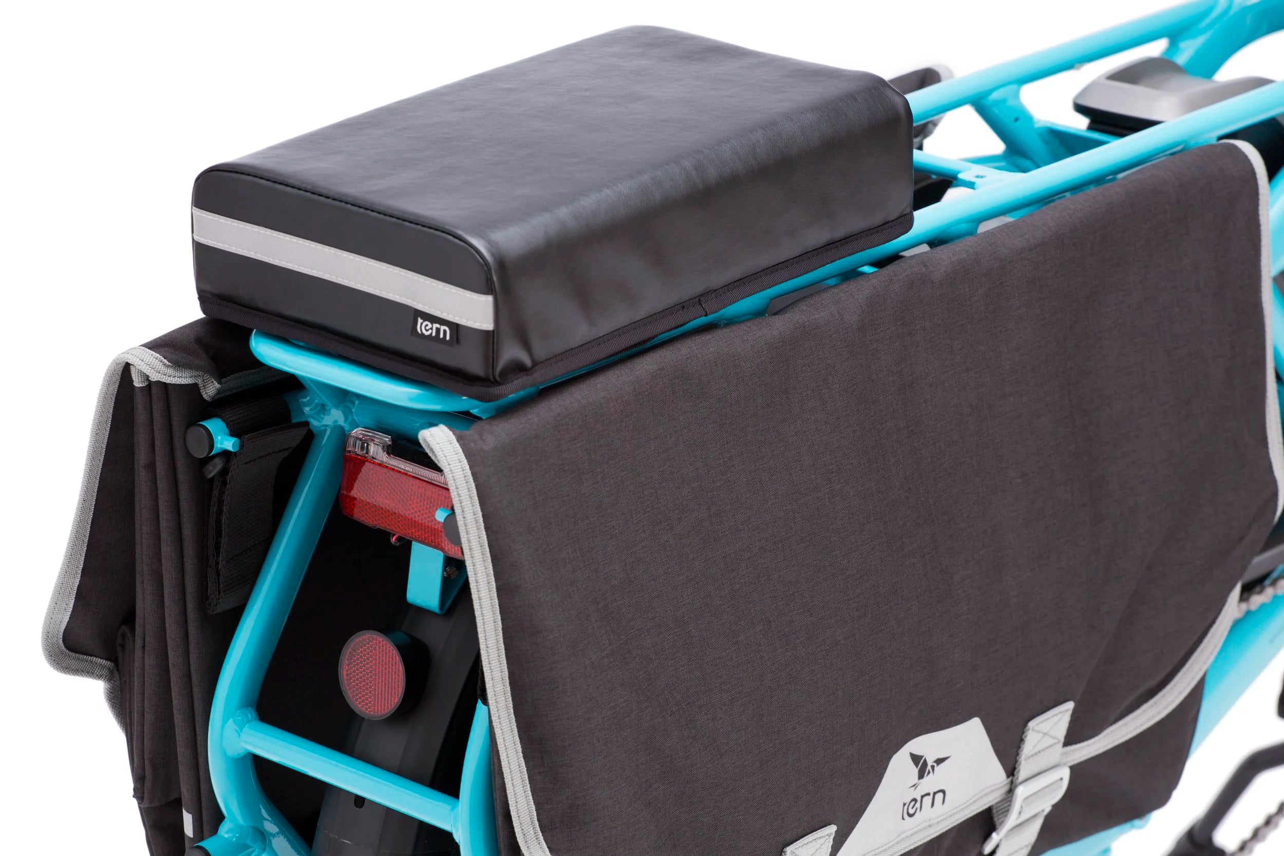 Black and gray bags attached to a blue bicycle rack with 'tern' branding.