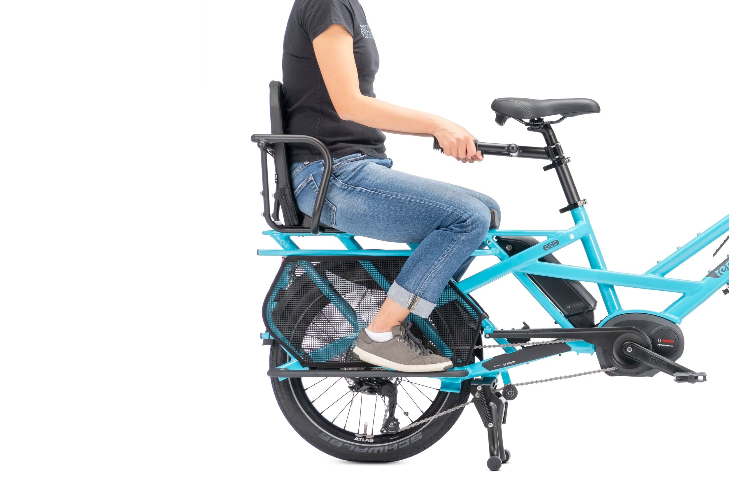 Person riding a blue cargo bicycle on a white background
