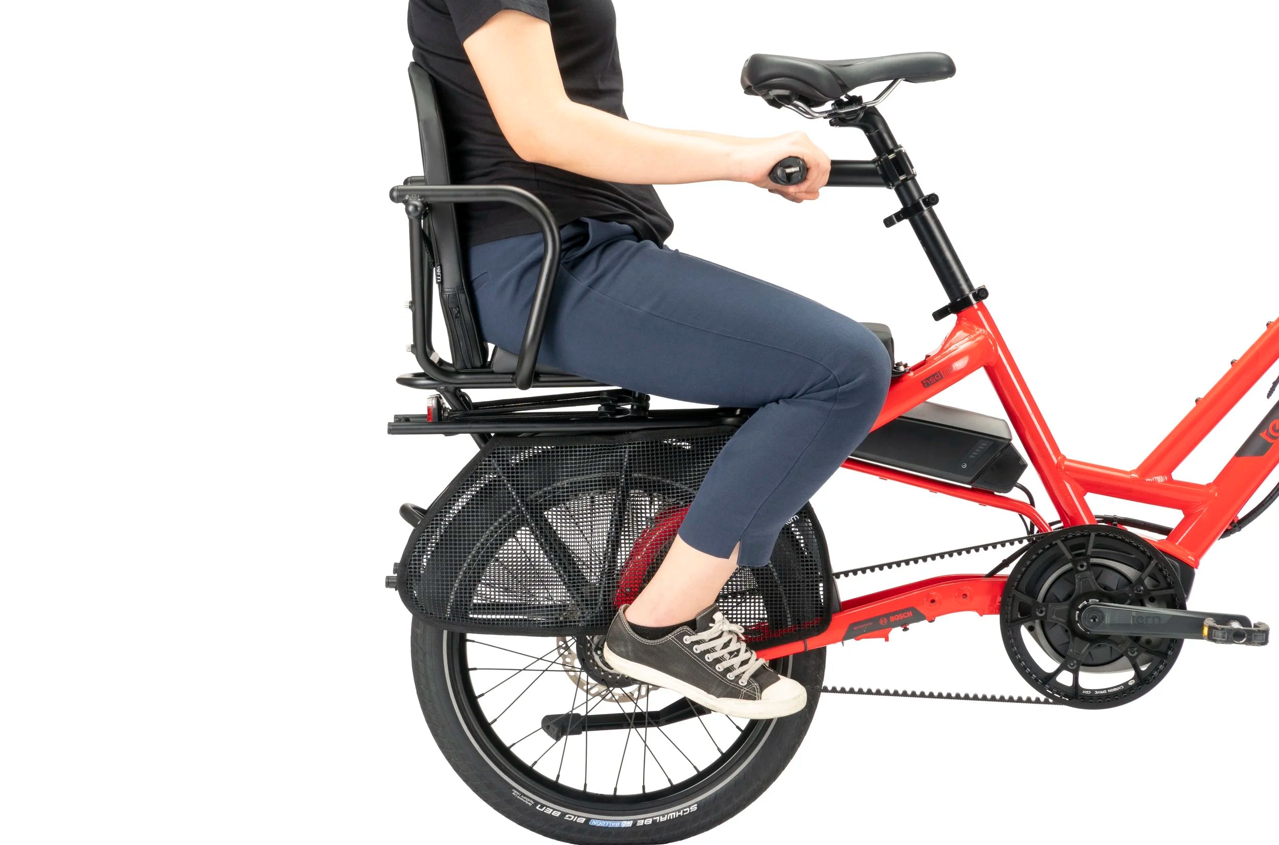 Person sitting on a red electric bike with a child seat on a white background