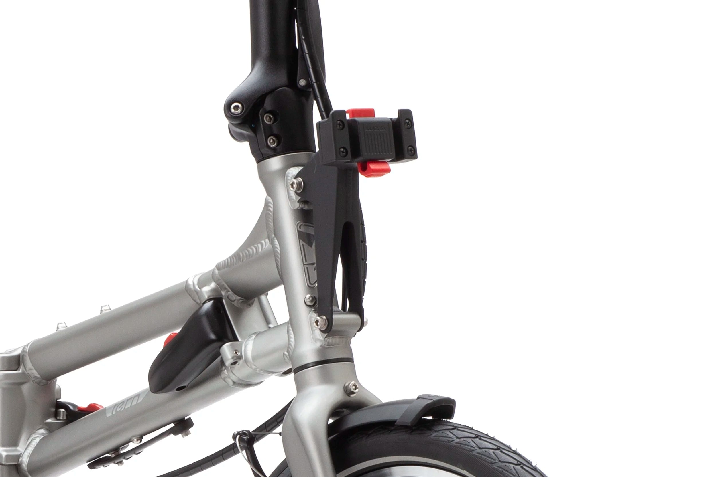 Close-up of a silver folding bike with black front bag mounting components on a white background