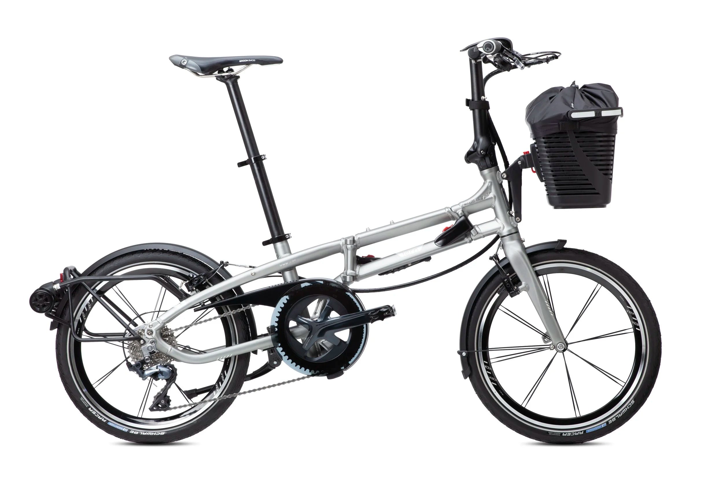 Silver folding bike with a black basket on a white background