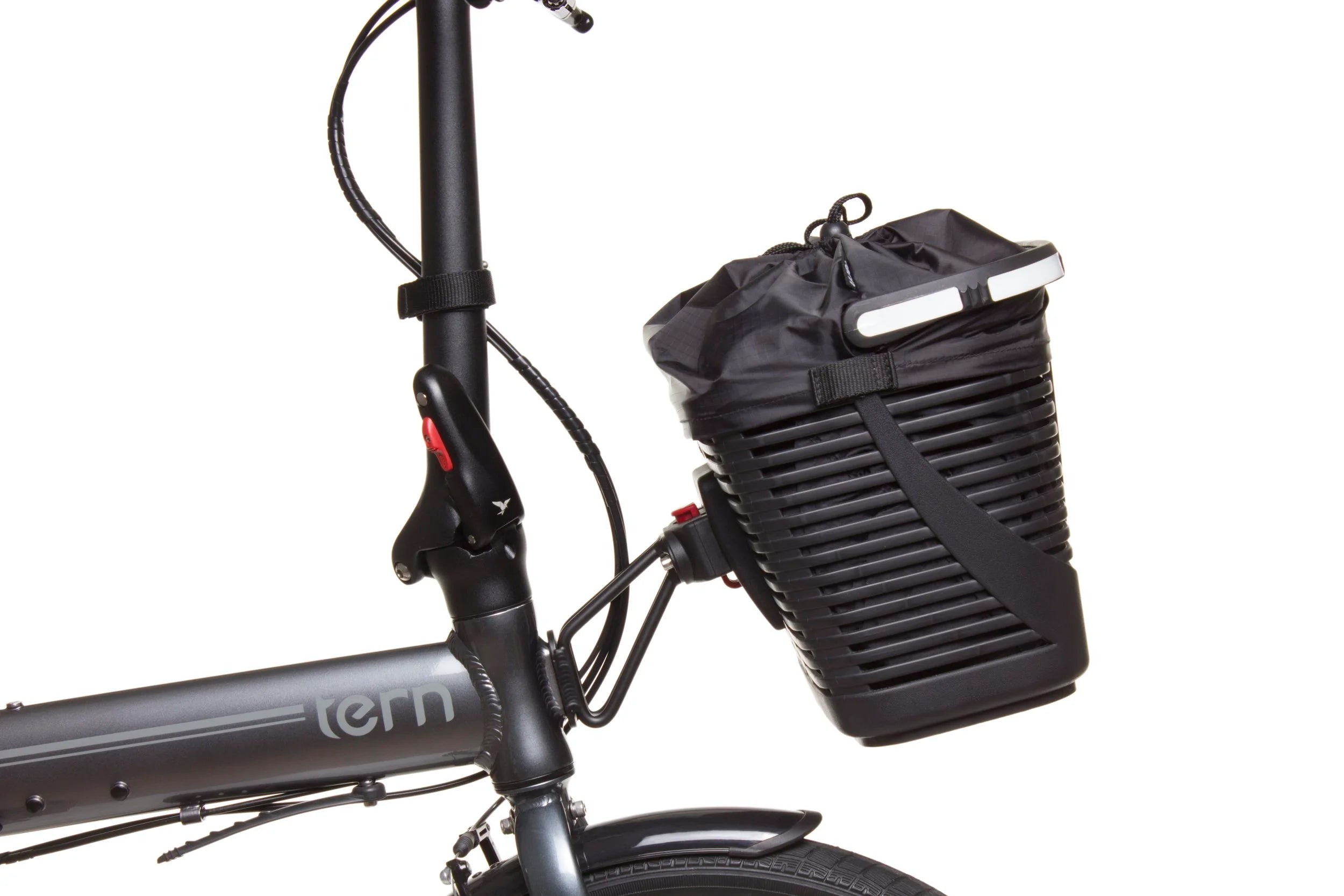 Black bicycle basket attached to a bike frame with 'tern' branding on a white background