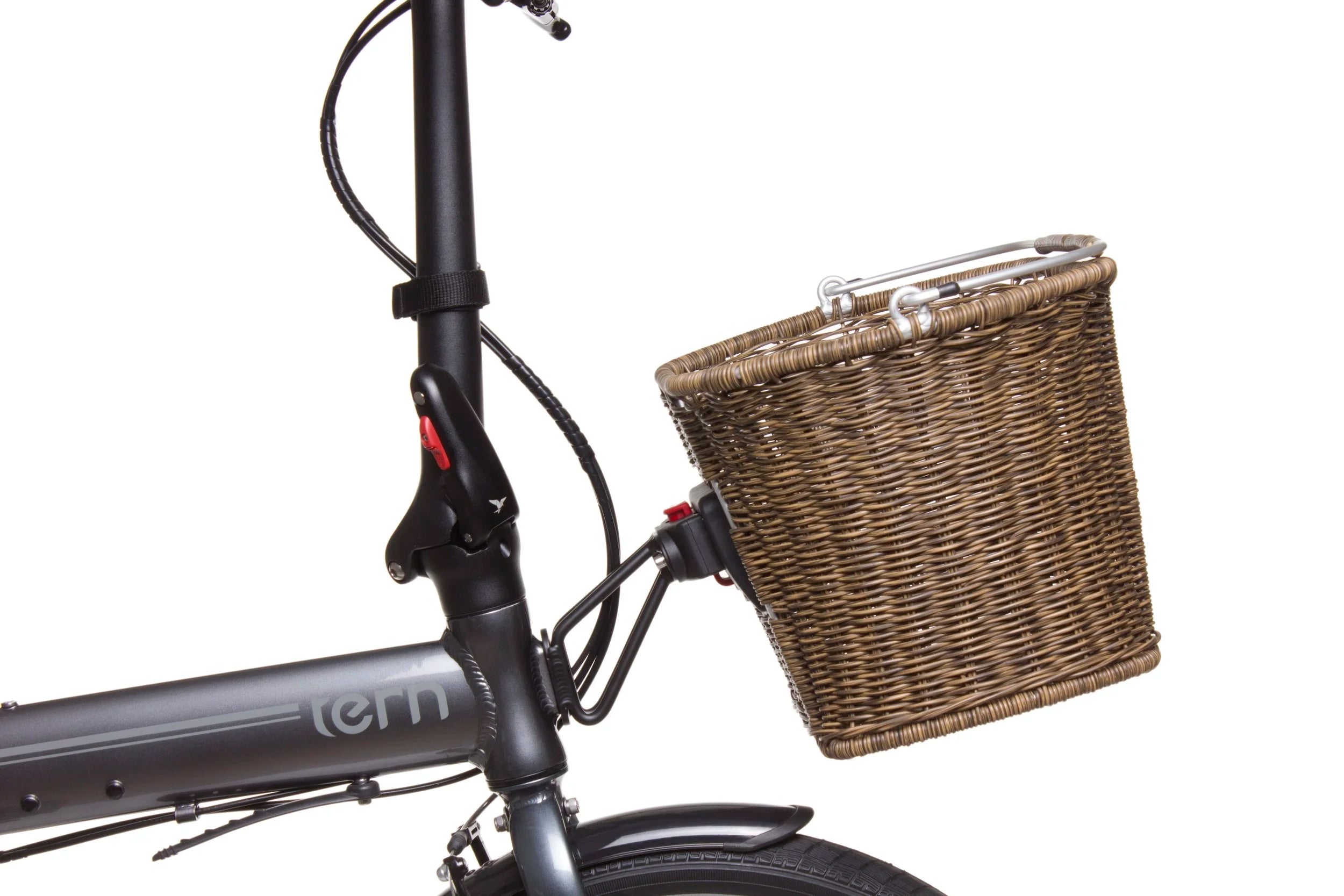 Bicycle with a wicker basket attached to the handlebar on a white background