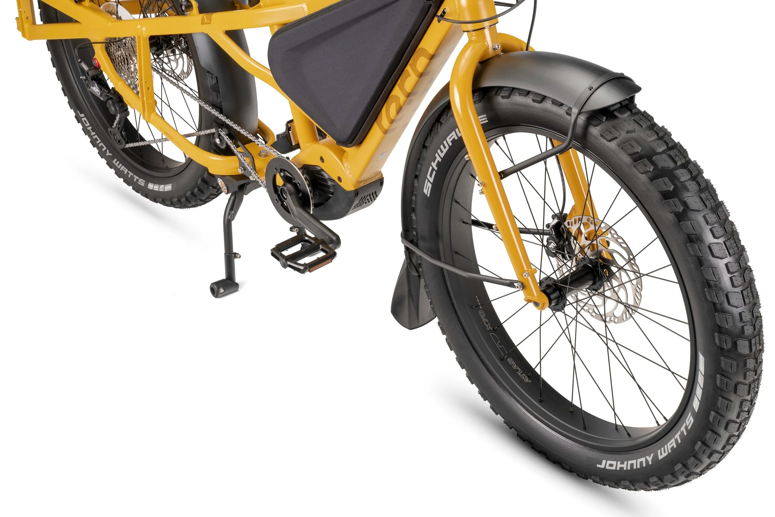 Yellow electric bike with a close-up of the wheel and suspension on a white background