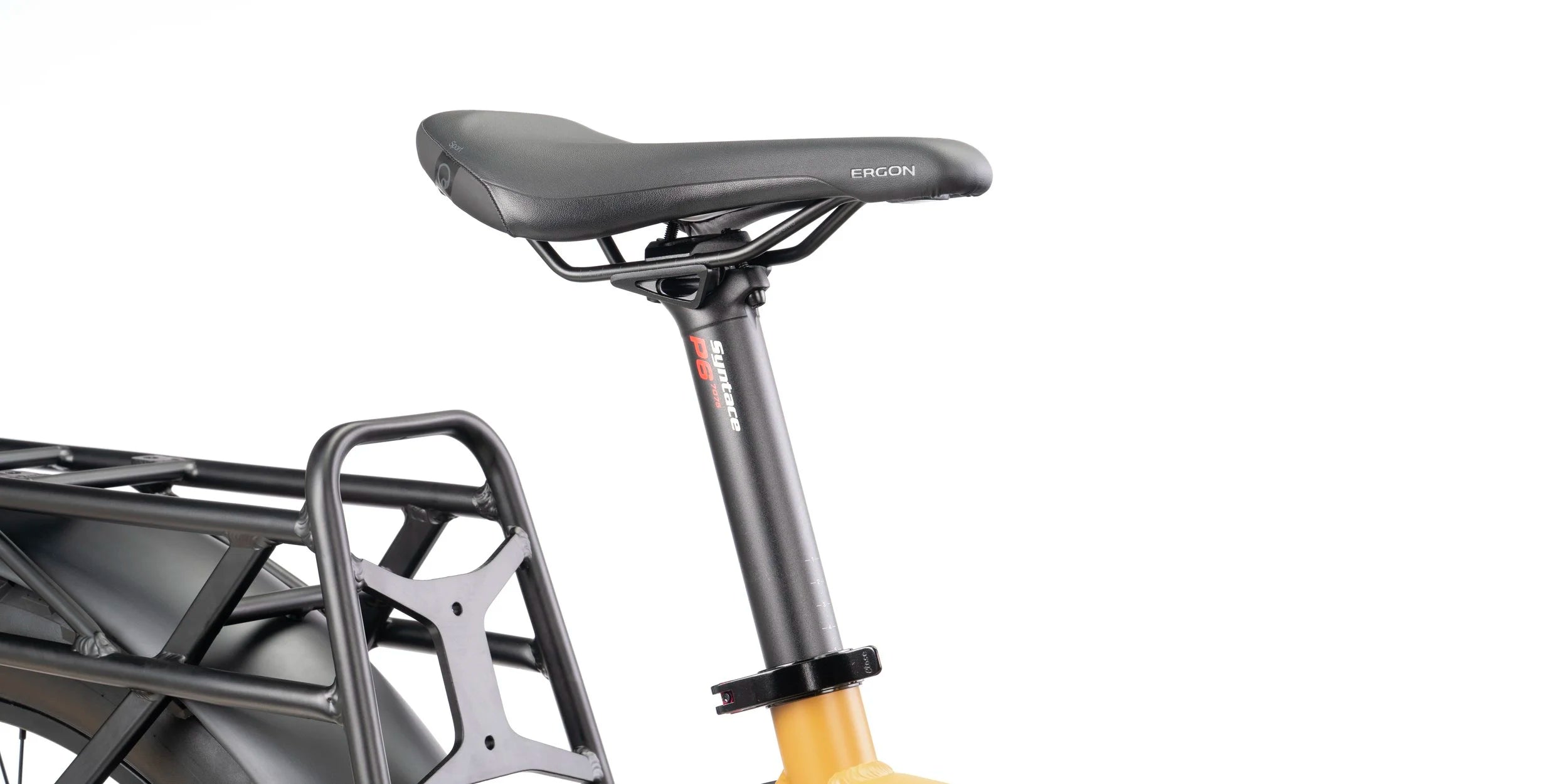 Close-up of a bicycle seat and rear rack on a white background