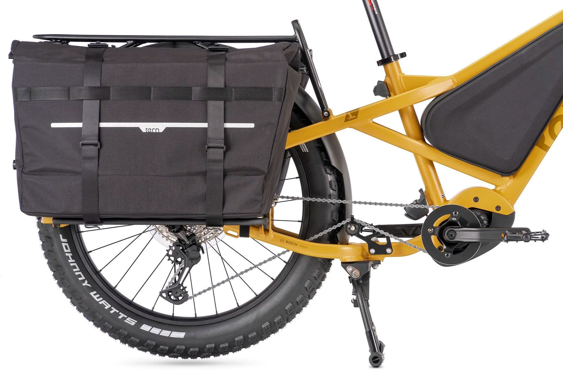 Yellow bicycle with black pannier bags on a white background