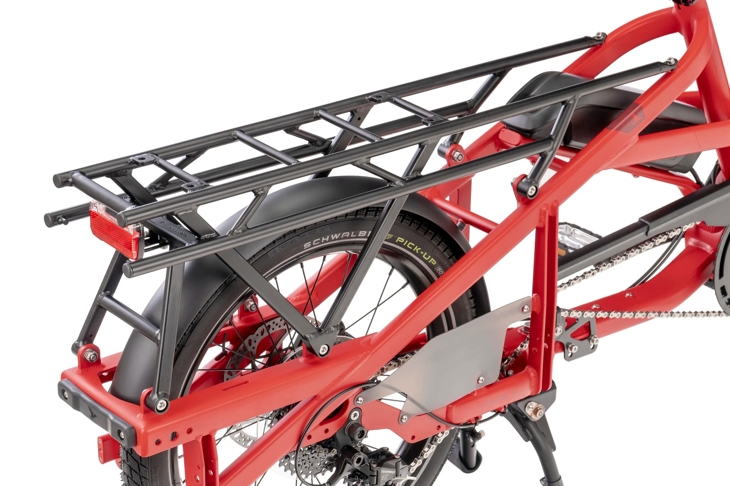 Red cargo bicycle with a black cargo rack on a white background