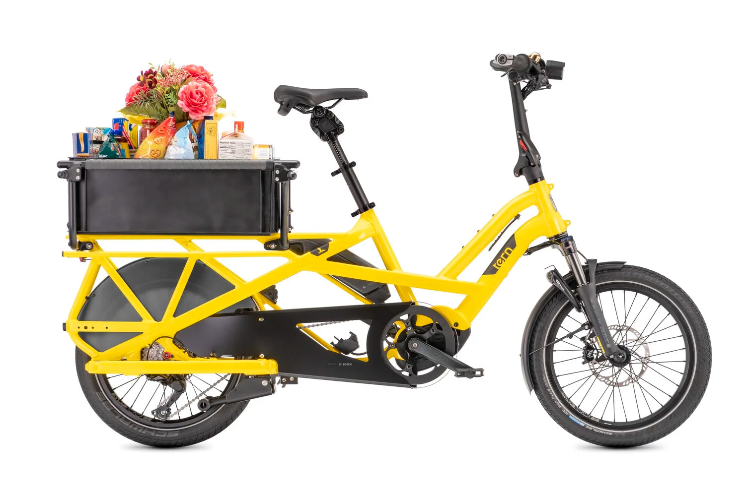 Yellow Tern cargo bicycle with black box on the rear rack with groceries.
