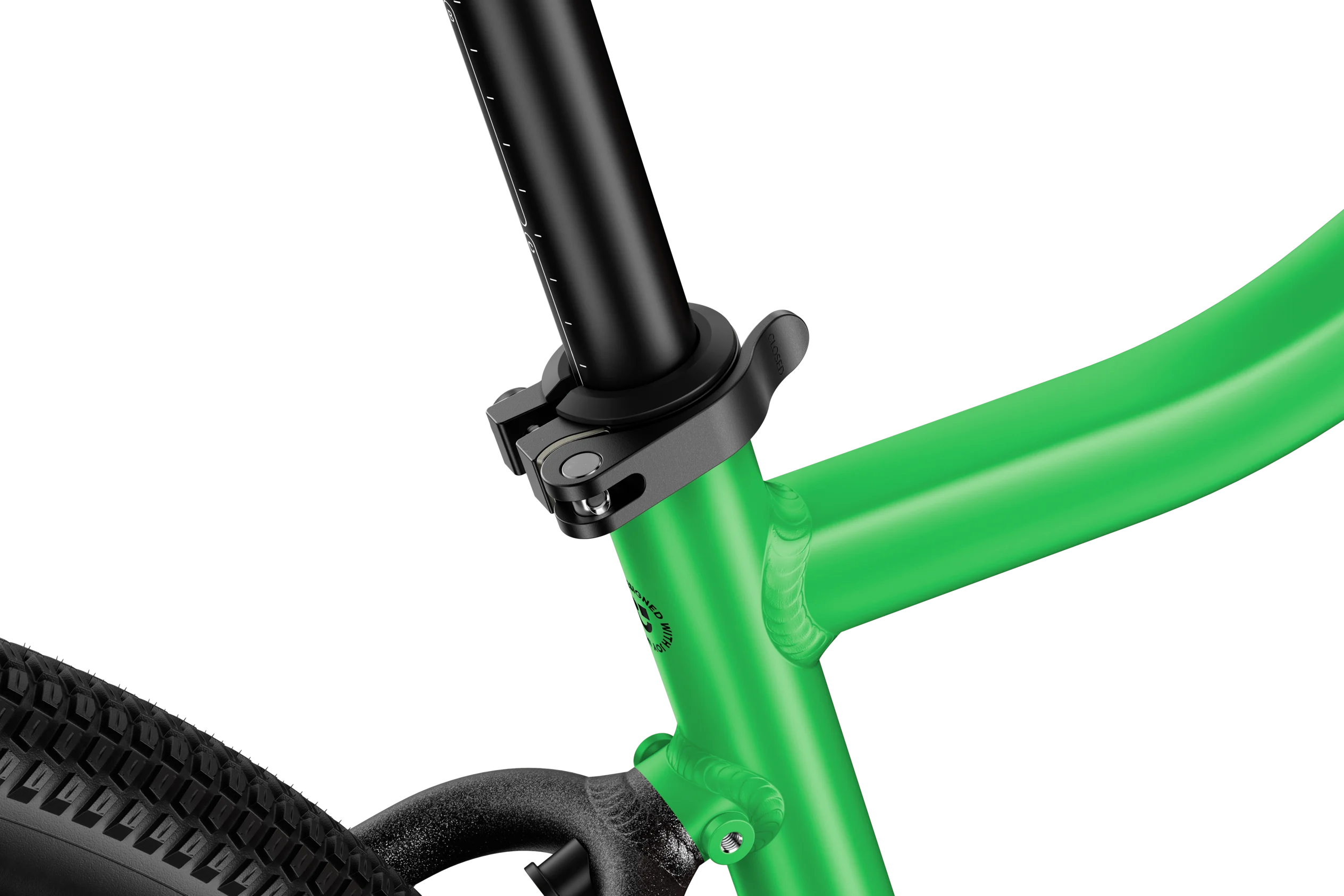 Close-up of a green bicycle frame with black components on a white background