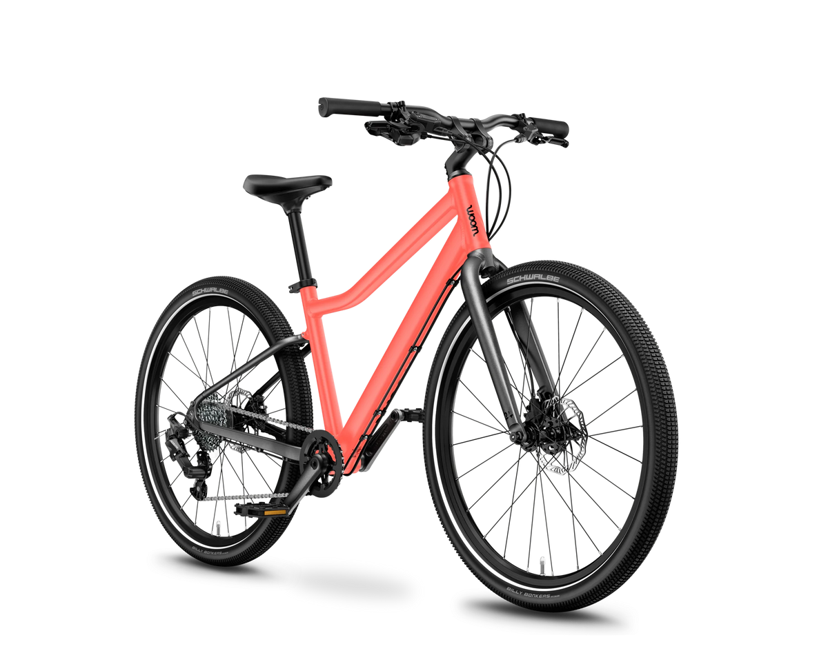 Pink Woom Explore 5 bicycle on a white background