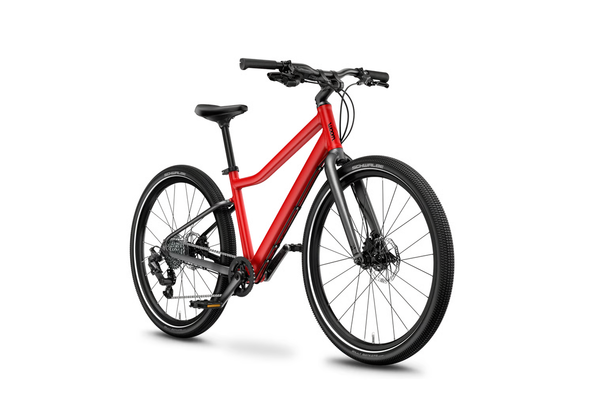 Red woom kids bike on a white background