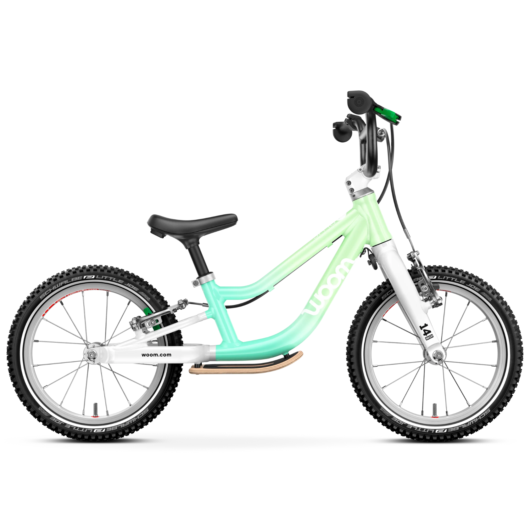 Green and white Woom balance bike on a white background