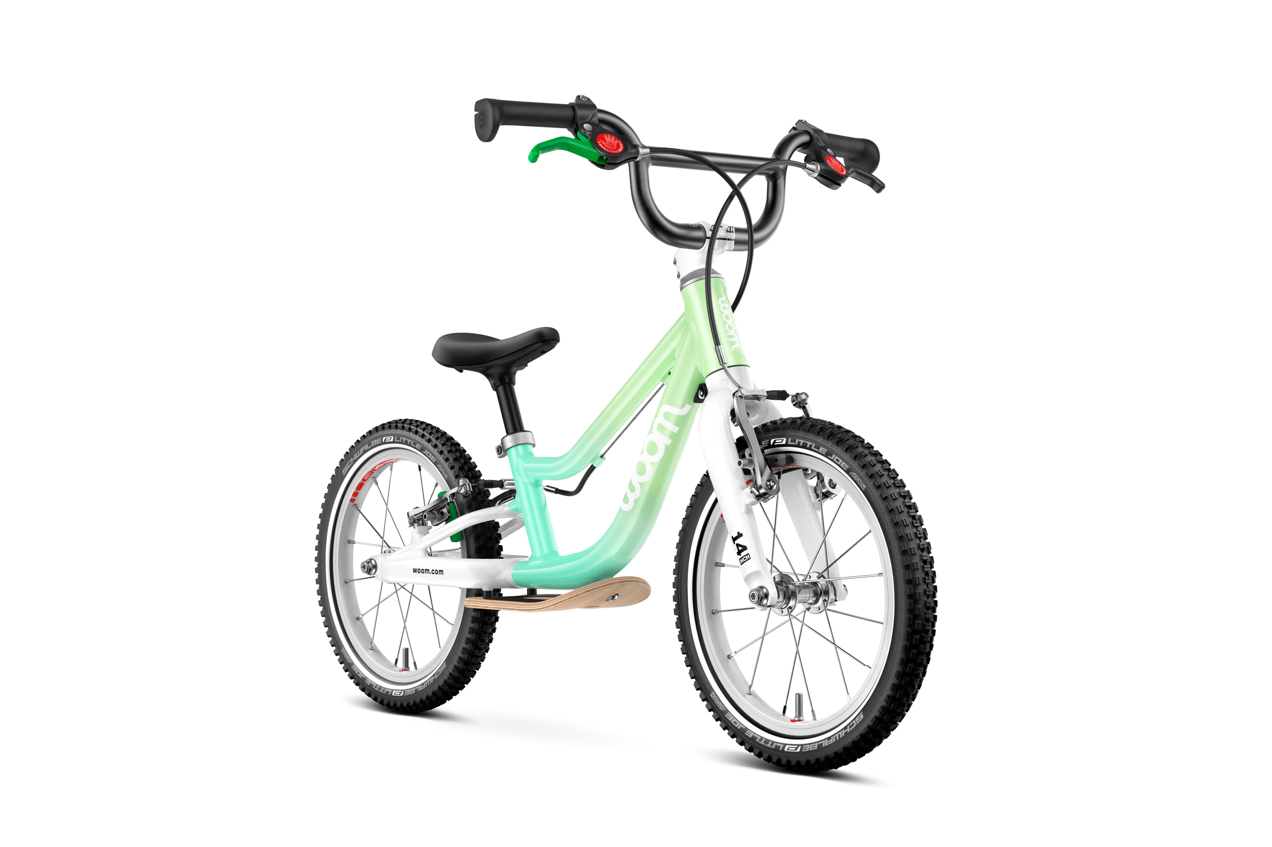 Children's Woom balance bicycle with a light green frame on a white background