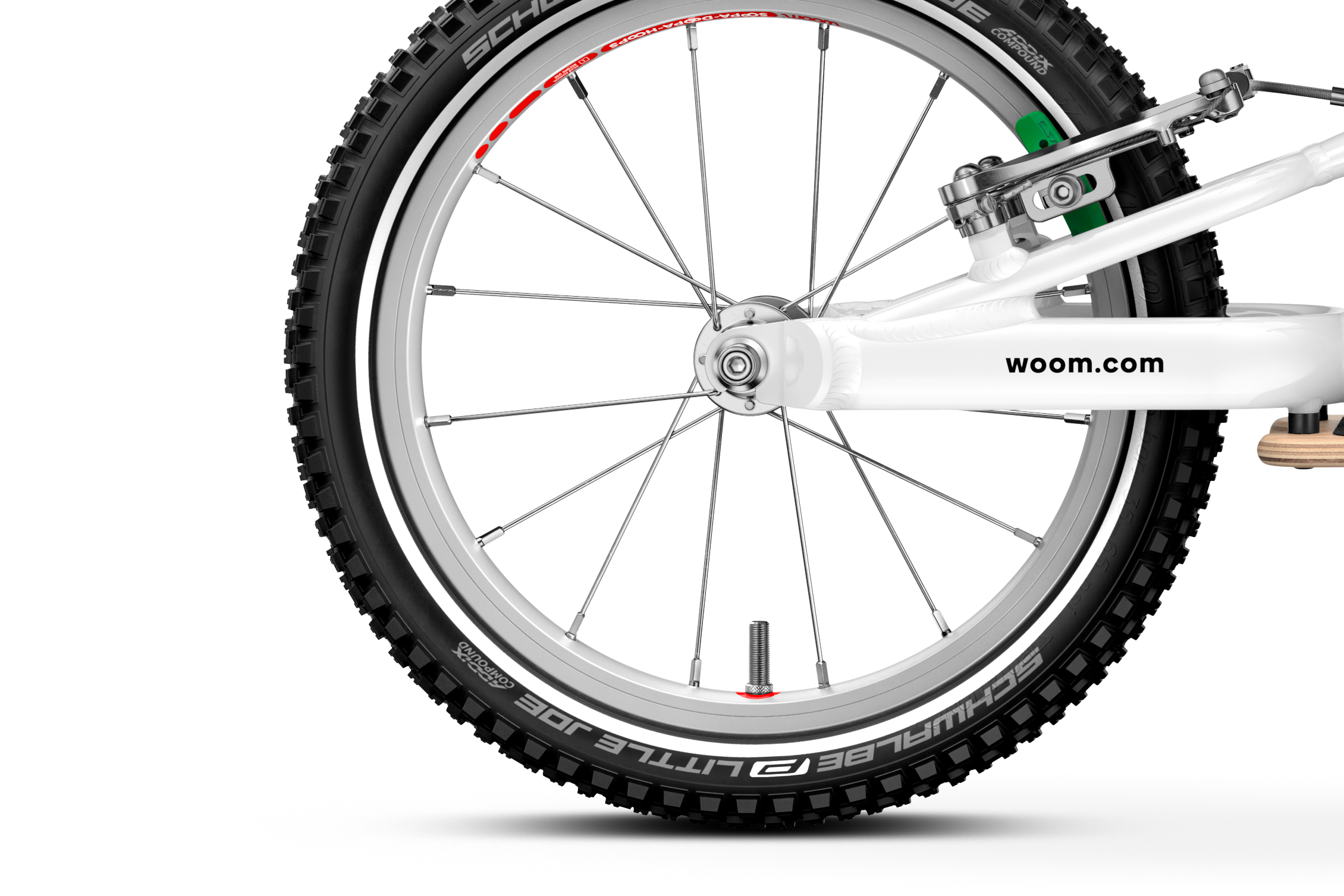 Close-up of a bicycle wheel with 'woom' branding on a white background