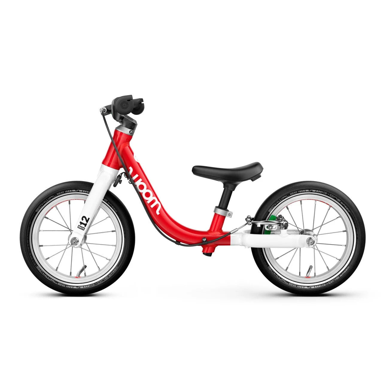Red and white Woom balance bike with 'Woom' branding on a white background
