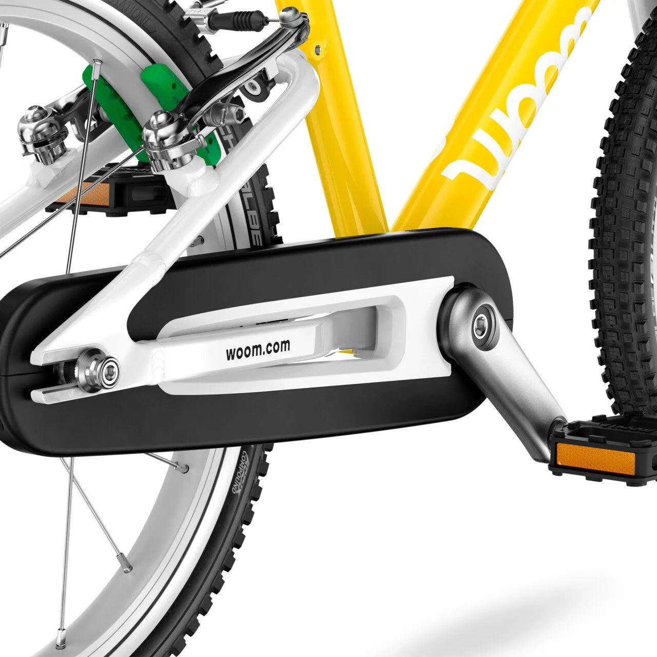 Close-up of a Woom bicycle chain guard with 'woom.com' branding on a white background
