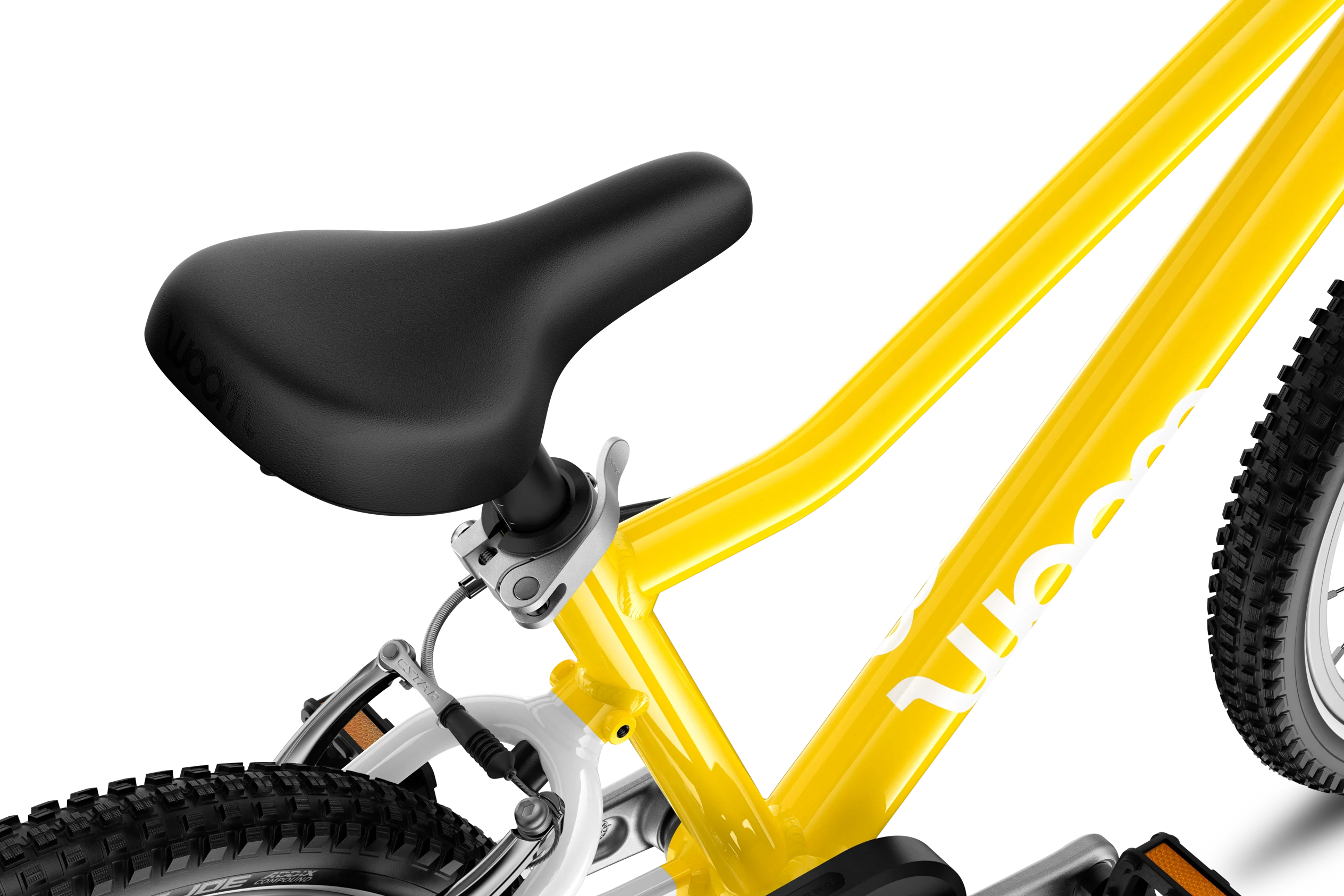 Yellow children's bicycle with black seat on a white background
