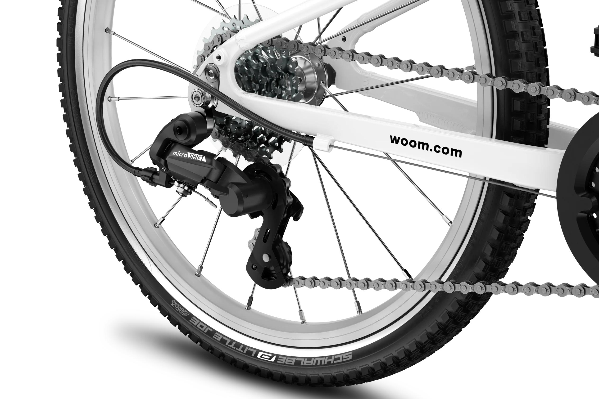 Close-up of a Woom bicycle wheel with chain and gear system, featuring the 'woom' brand.