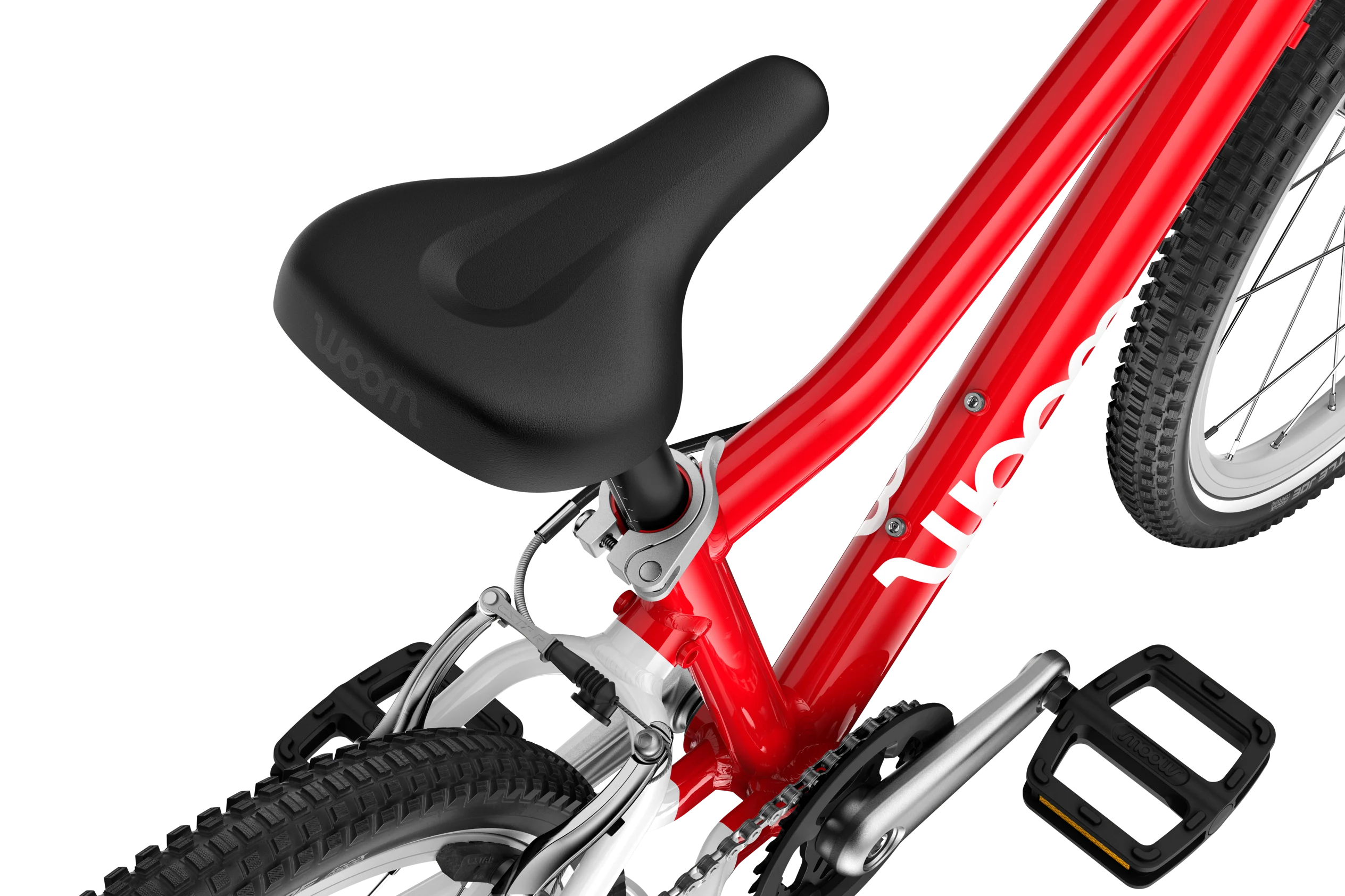 Red Woom children's bicycle with black seat and pedals on a white background