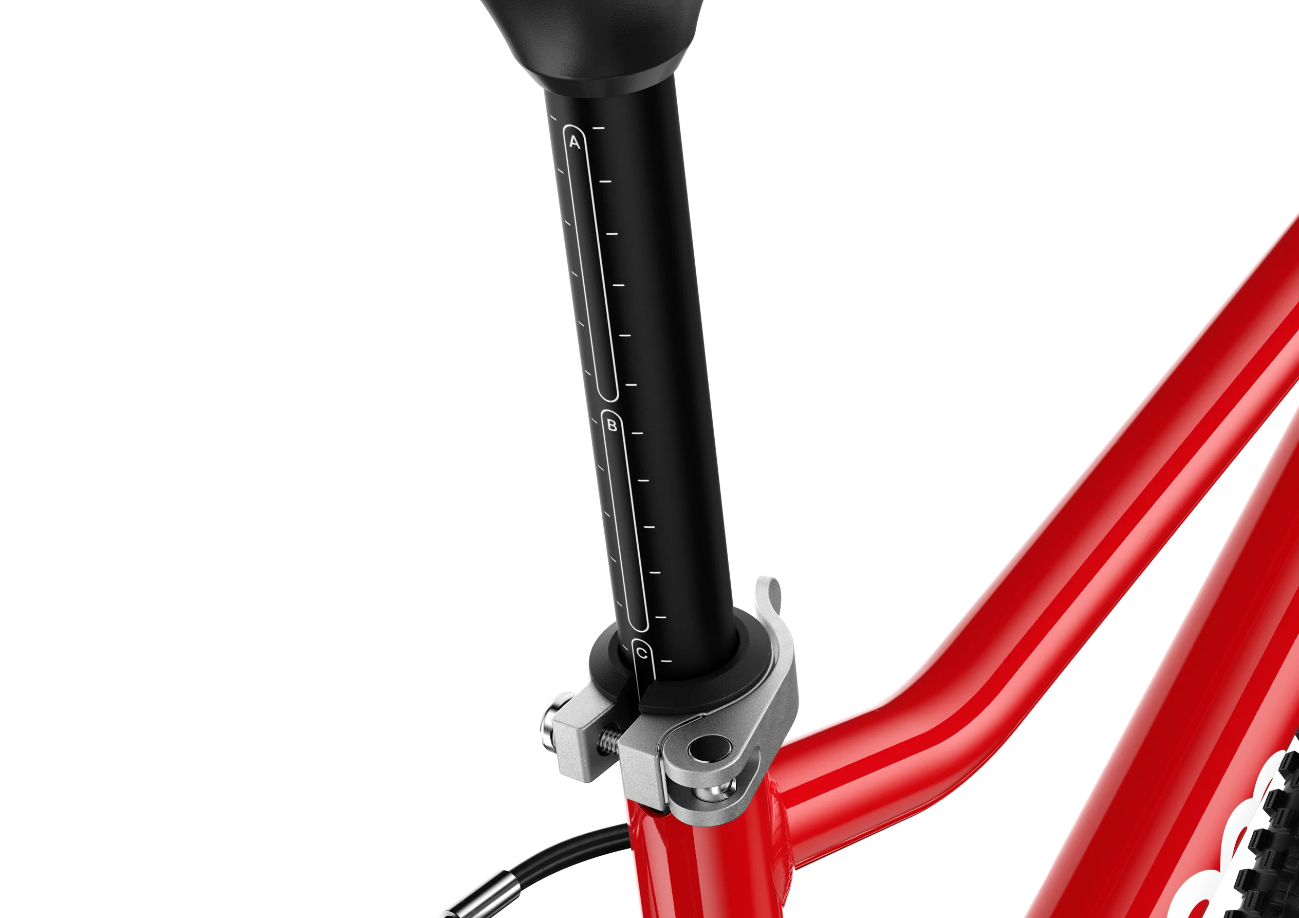 Close-up of a red Woom bicycle frame with a black seat post and a silver clamp on a white background