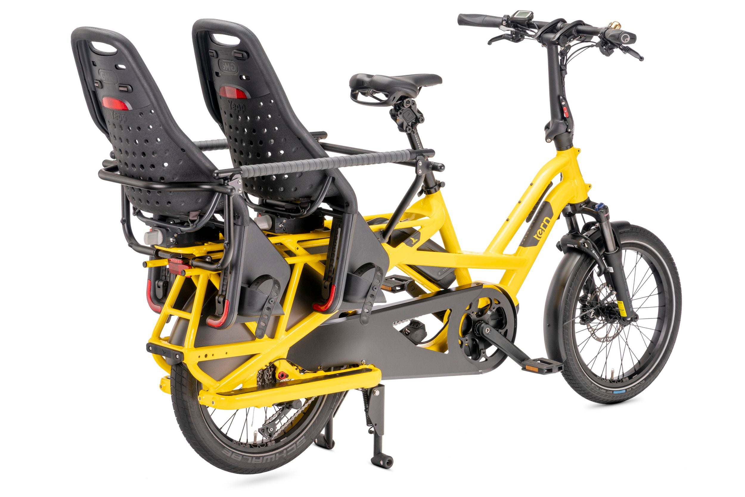 Yellow electric cargo bike with two black child seats on a white background