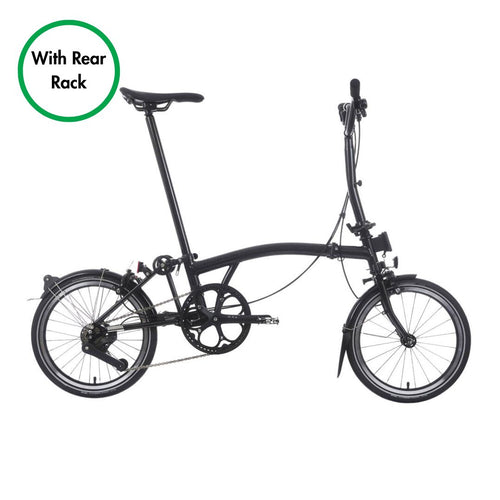 Black folding bicycle with rear rack on a white background