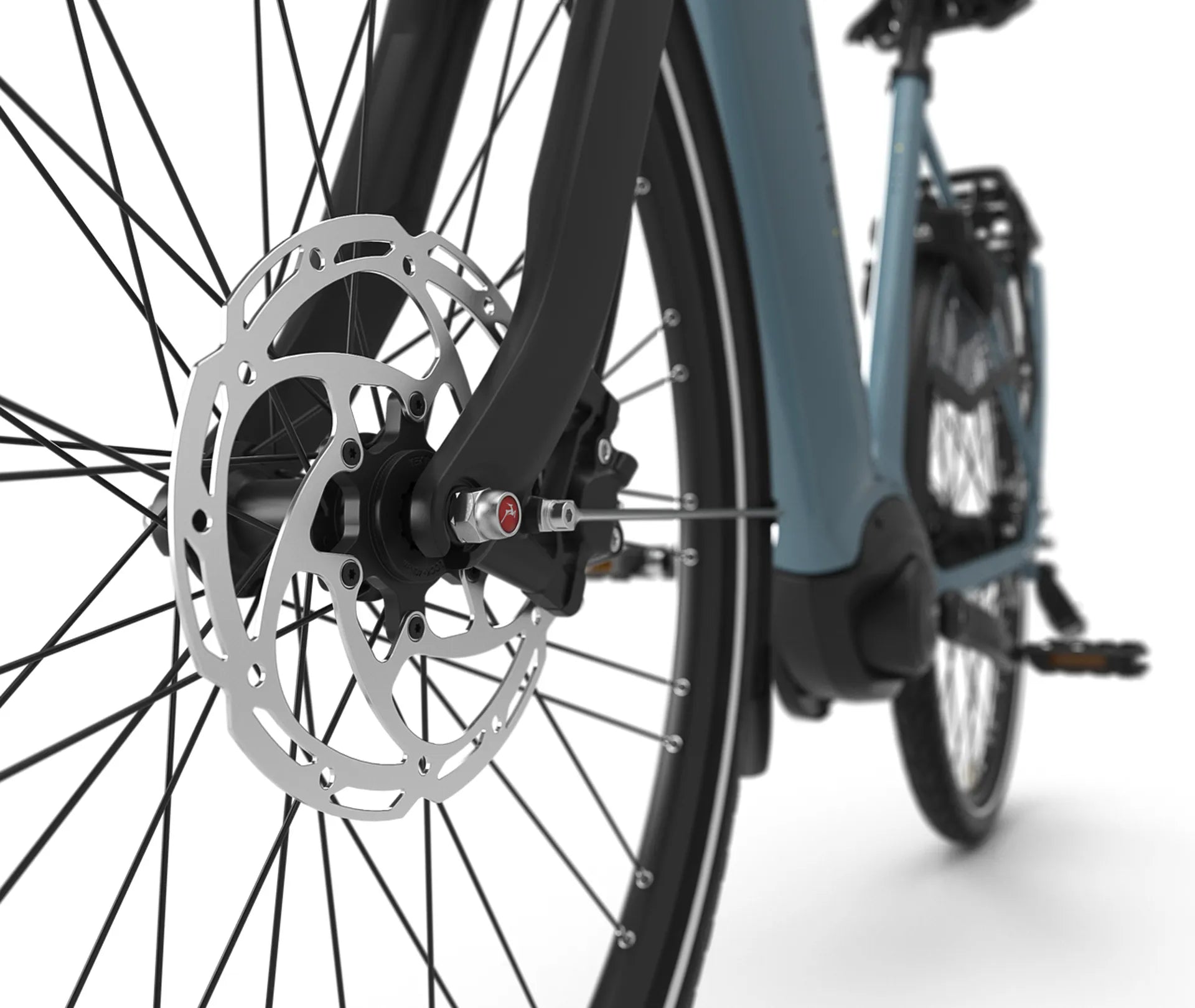 Close-up of a bicycle wheel with disc brake on a white background