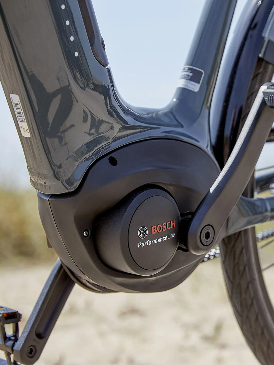 Bosch Motor on a blue bicycle on the blurry background
