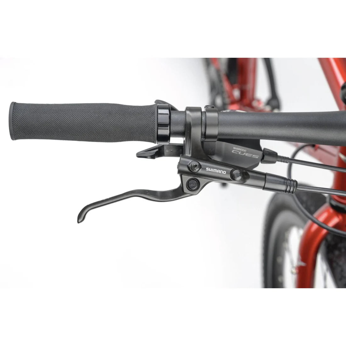 Close-up of bicycle handlebar with Shimano components on a white background