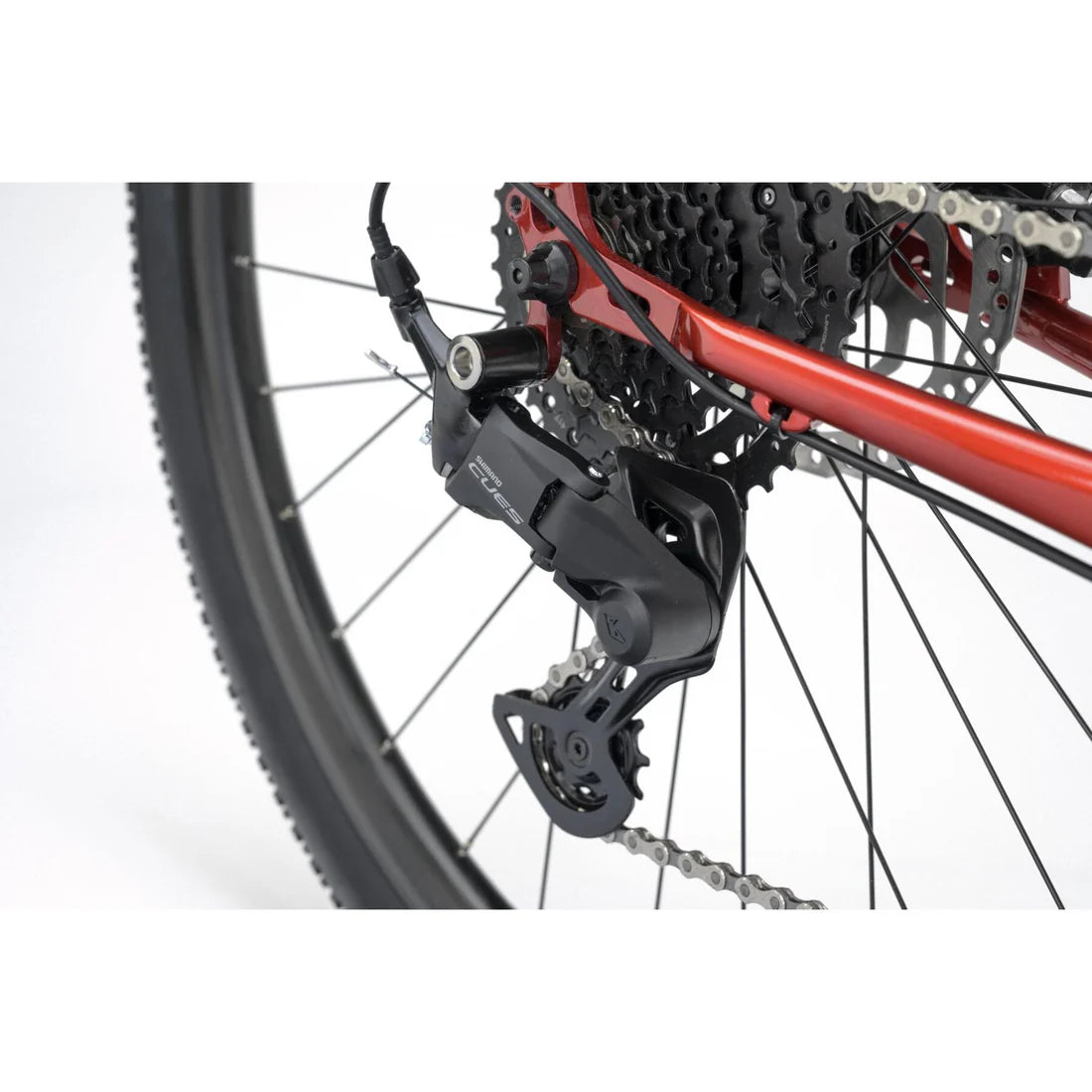 Close-up of a bicycle's gear system on a white background