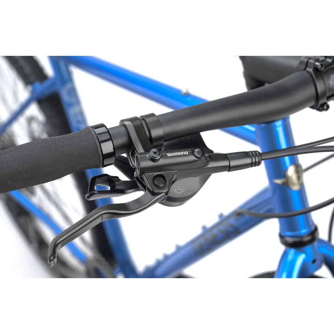 Close-up of bicycle handlebars with Shimano brakes on a blue frame.