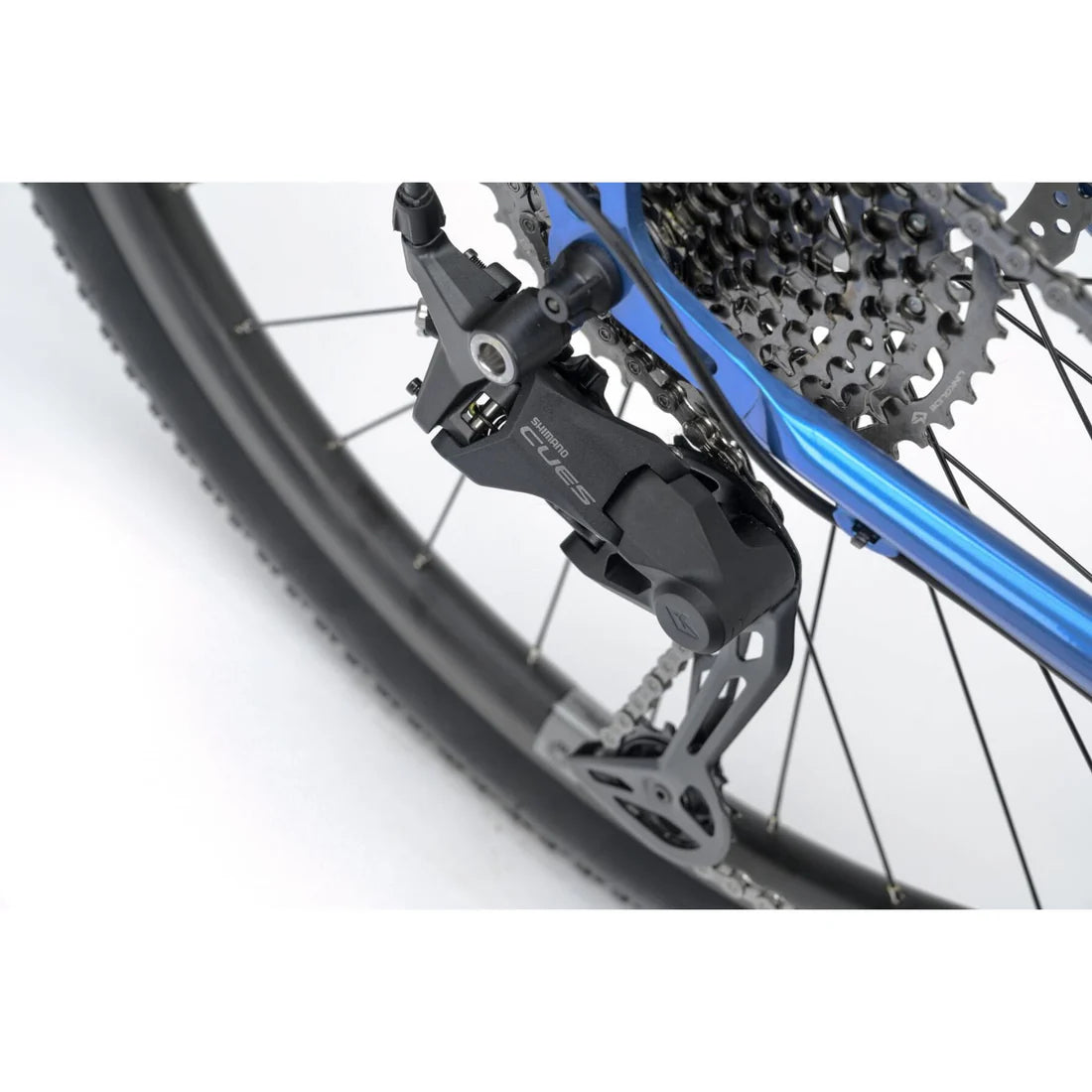 Close up of a derailleur on a blue bicycle