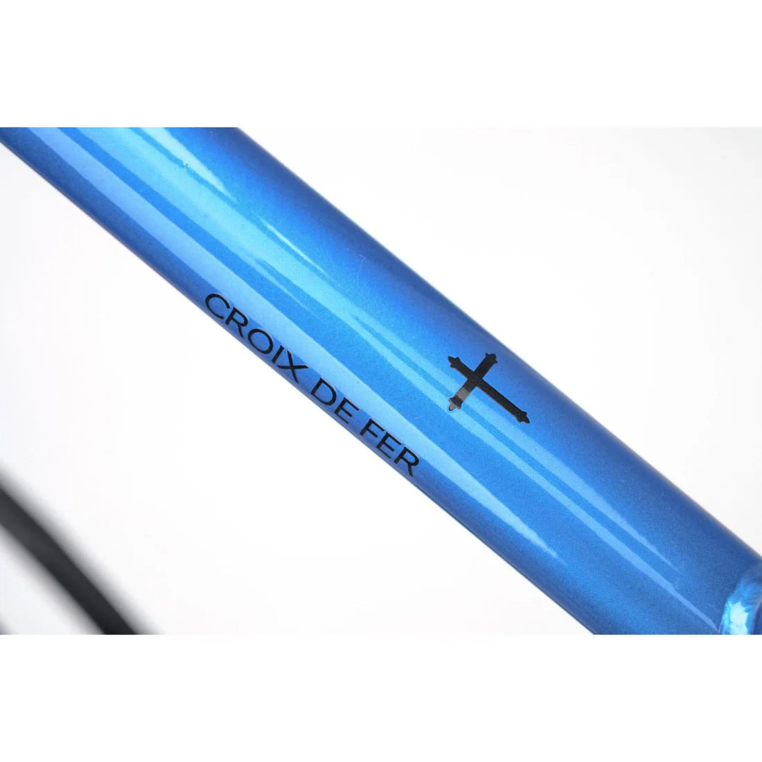 close up of a blue bicycle frame on a white background