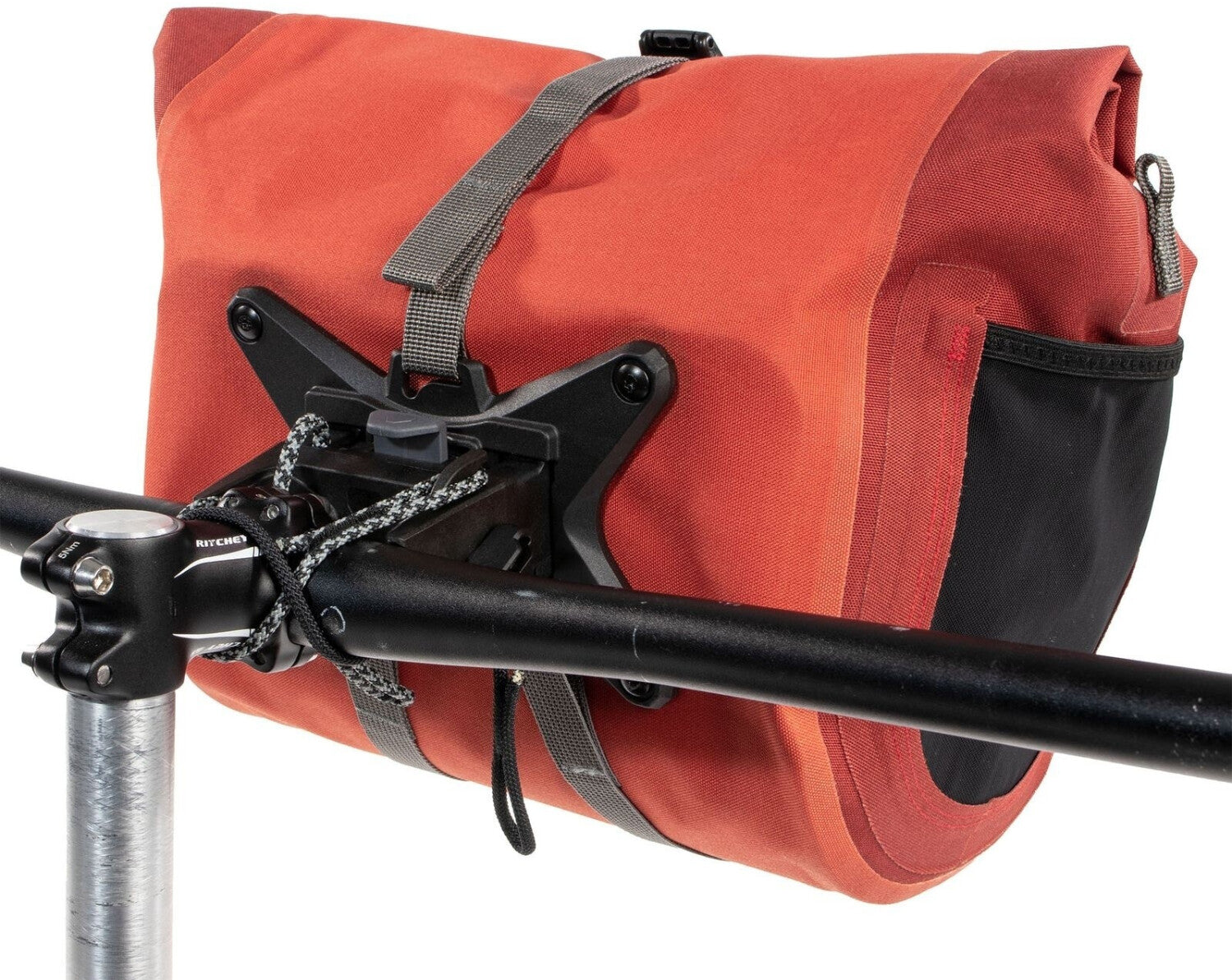 Red bike bag attached to a bicycle handlebar with a white background