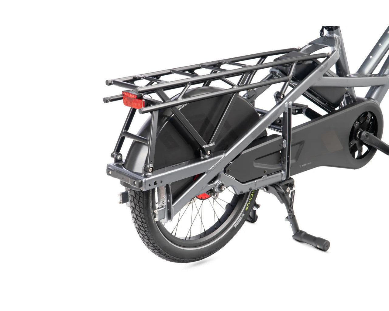 A dark grey Tern electric cargo bike with a rear utility rack, kickstand, and black rear wheel, shown from a three-quarters rear angle on a white background.