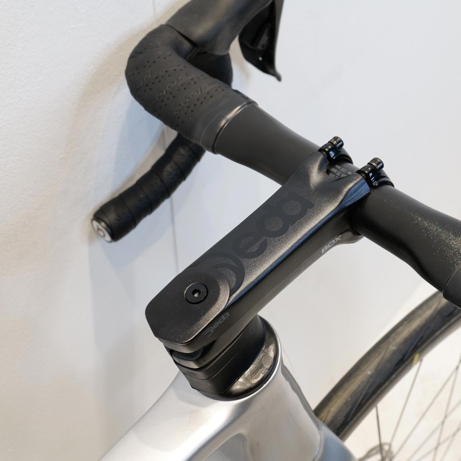 Black road bike handlebar on a white background