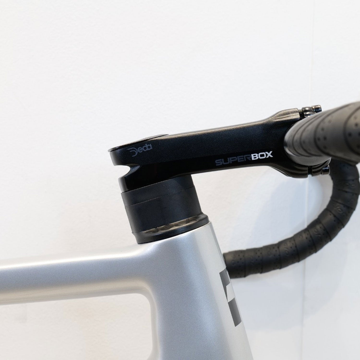 Bicycle stem and black handlebar on a white background